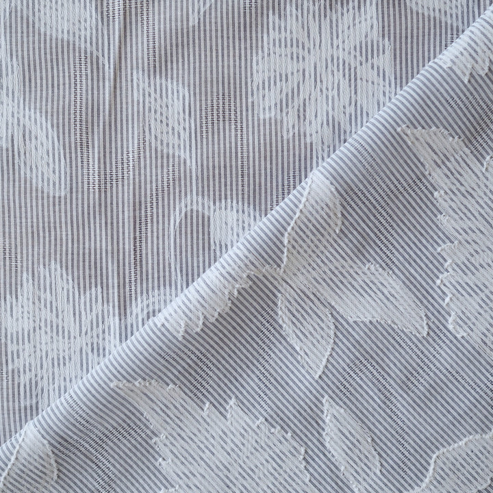 Blue striped jacquard cotton dressmaking fabric with woven floral design