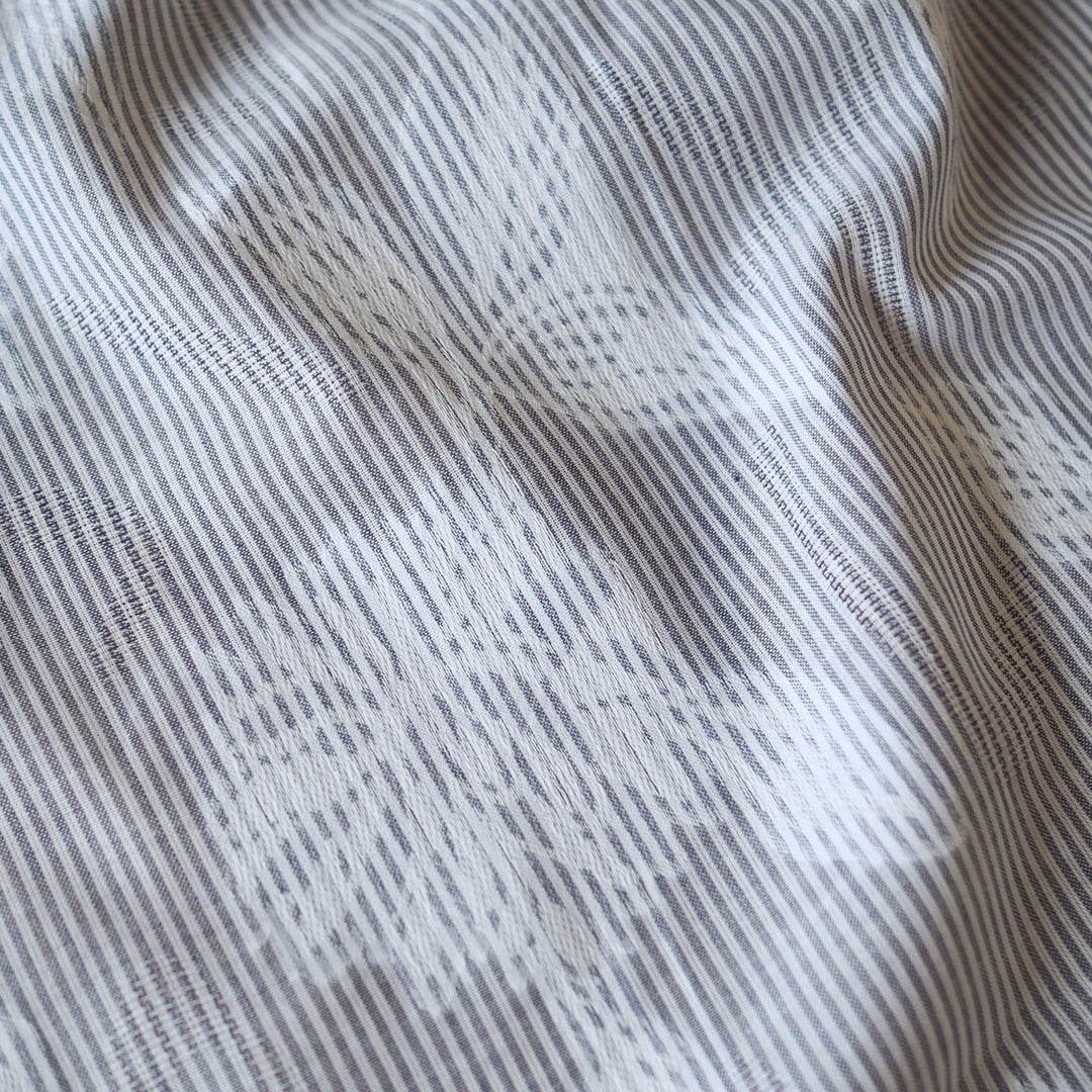 Blue striped jacquard cotton dressmaking fabric with woven floral design