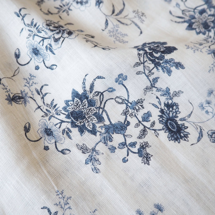White linen fabric with blue floral pattern