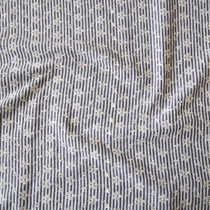 Cotton dressmaking fabric with grey and white design and floral embroidery