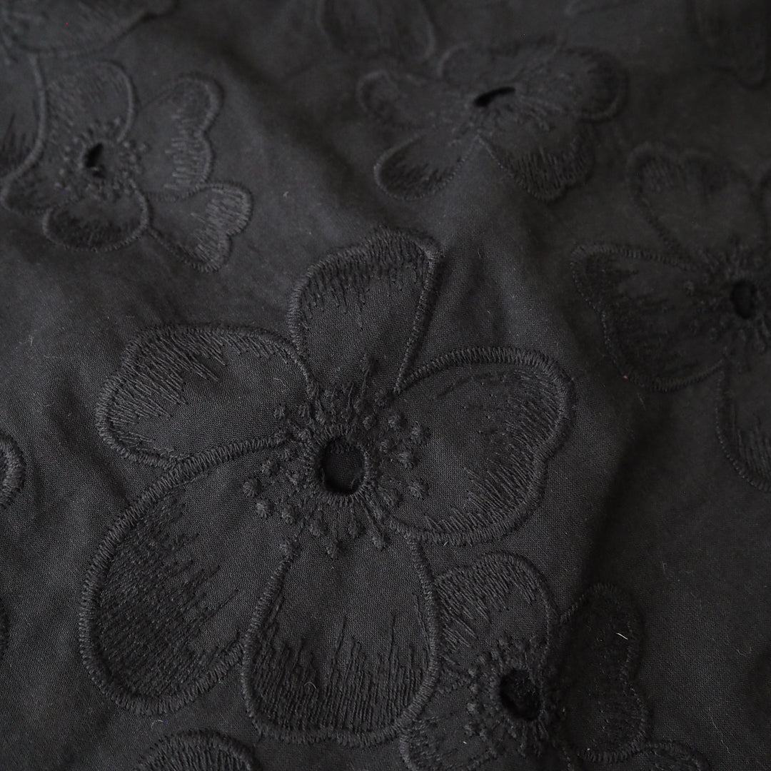 Black embroidered cotton dressmaking fabric with floral pattern