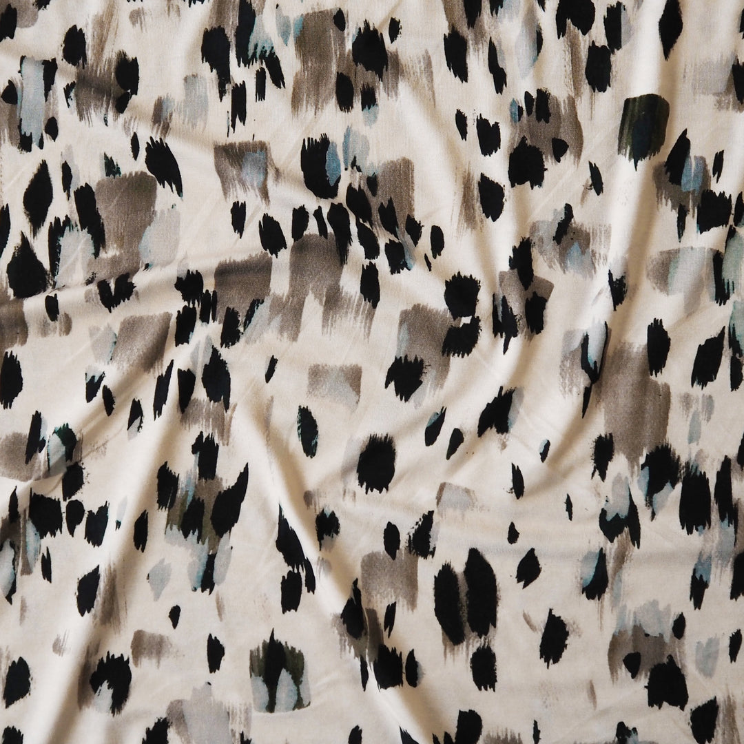 Stretchy viscose jersey dressmaking fabric with abstract pattern