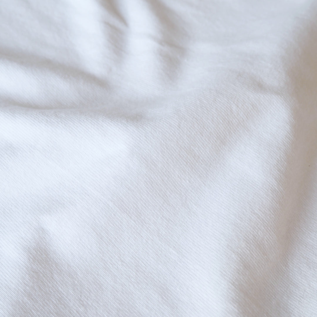 Heavy weight white cotton jersey dressmaking fabric