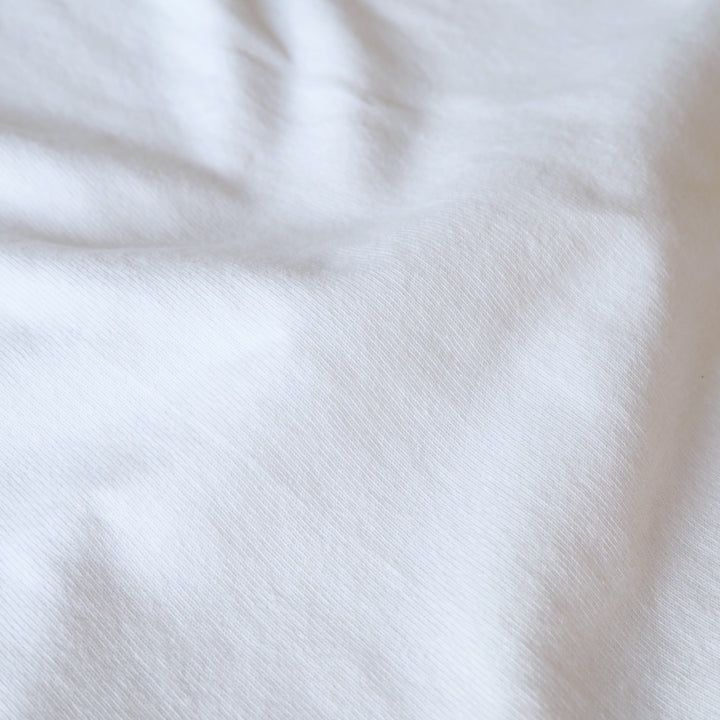 Heavy weight white cotton jersey dressmaking fabric