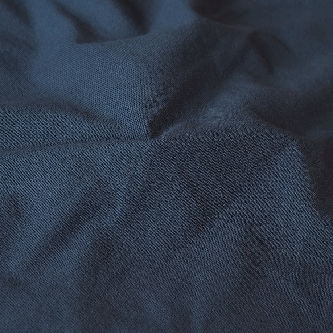 Heavy weight navy blue cotton jersey dressmaking fabric