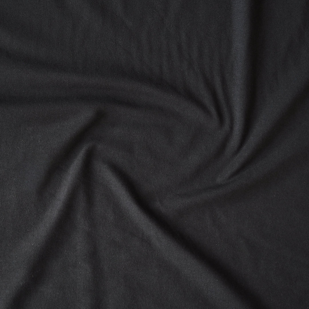 Heavy weight black cotton jersey dressmaking fabric