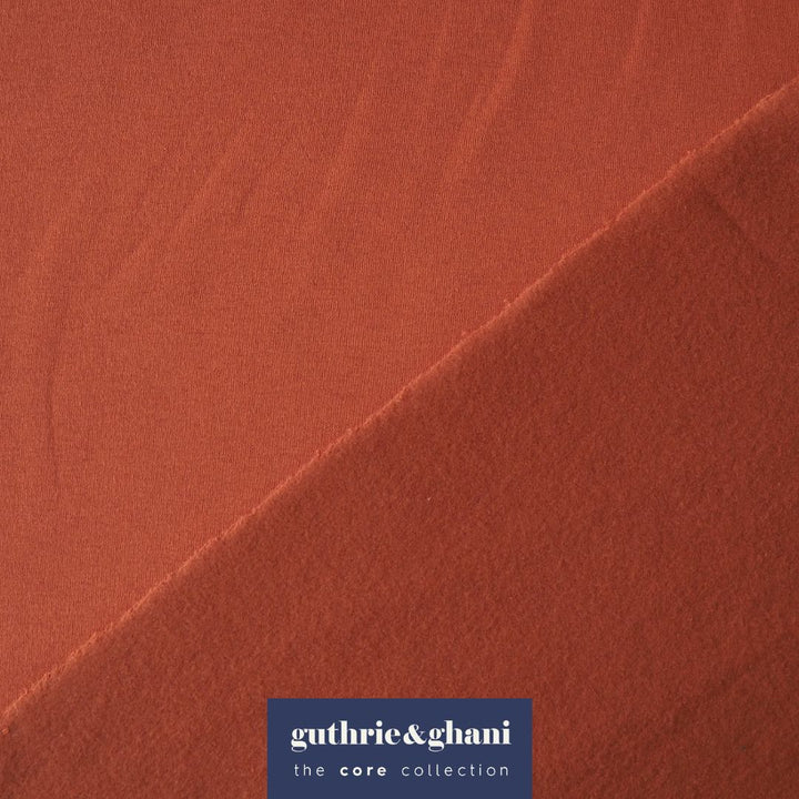 Terracotta fleeceback organic cotton sweatshirting fabric, cosy and stretchy for sweatshirts and joggers.