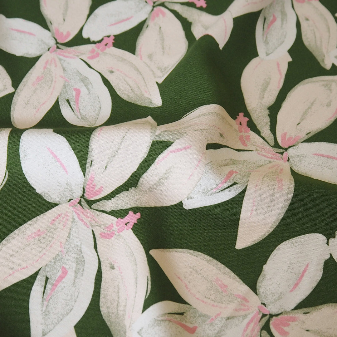 Olive tropical floral viscose fabric with pink accents for dressmaking