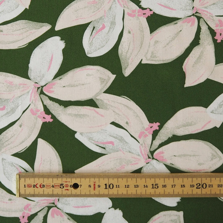 Olive tropical floral viscose fabric with pink accents for dressmaking