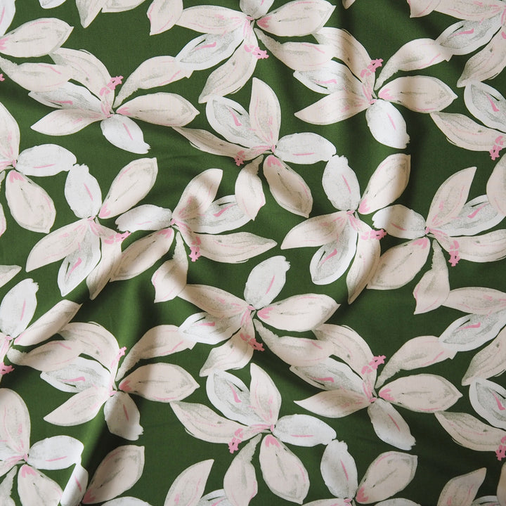 Olive tropical floral viscose fabric with pink accents for dressmaking