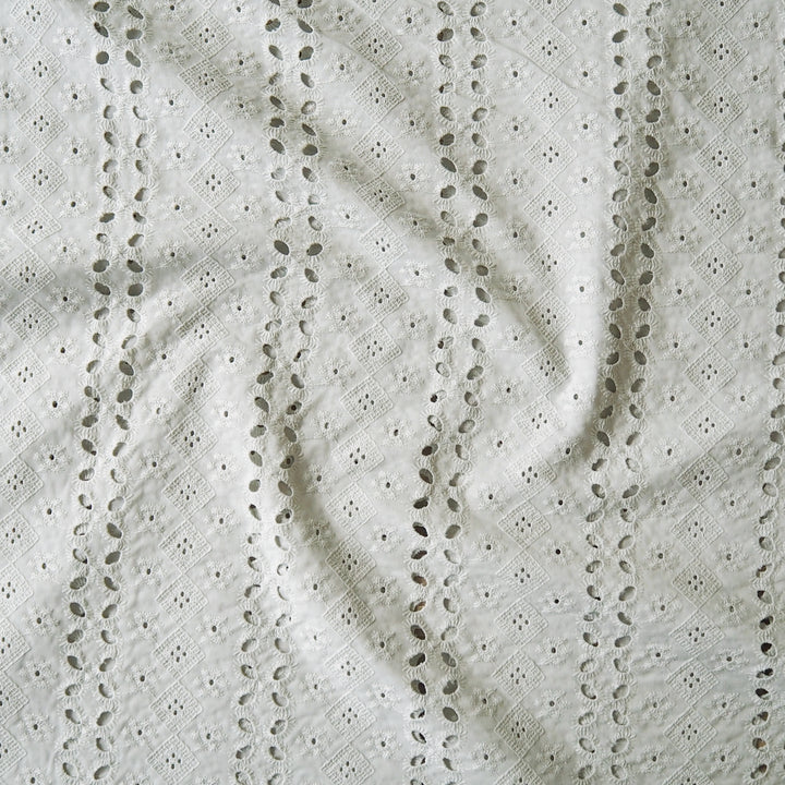 Pale pistachio eyelet stripe cotton fabric for dressmaking