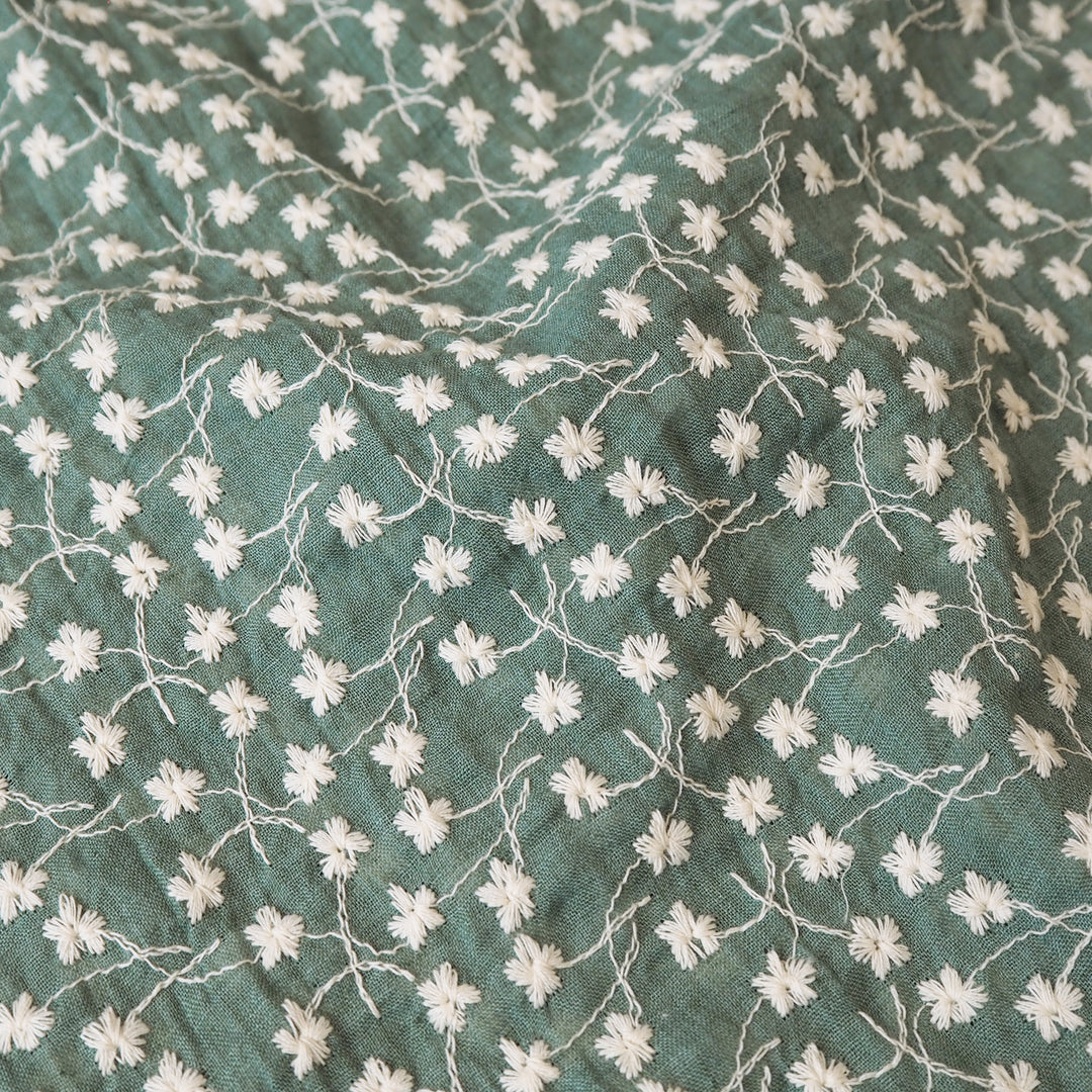 Bay leaf green embroidered cotton voile dressmaking fabric