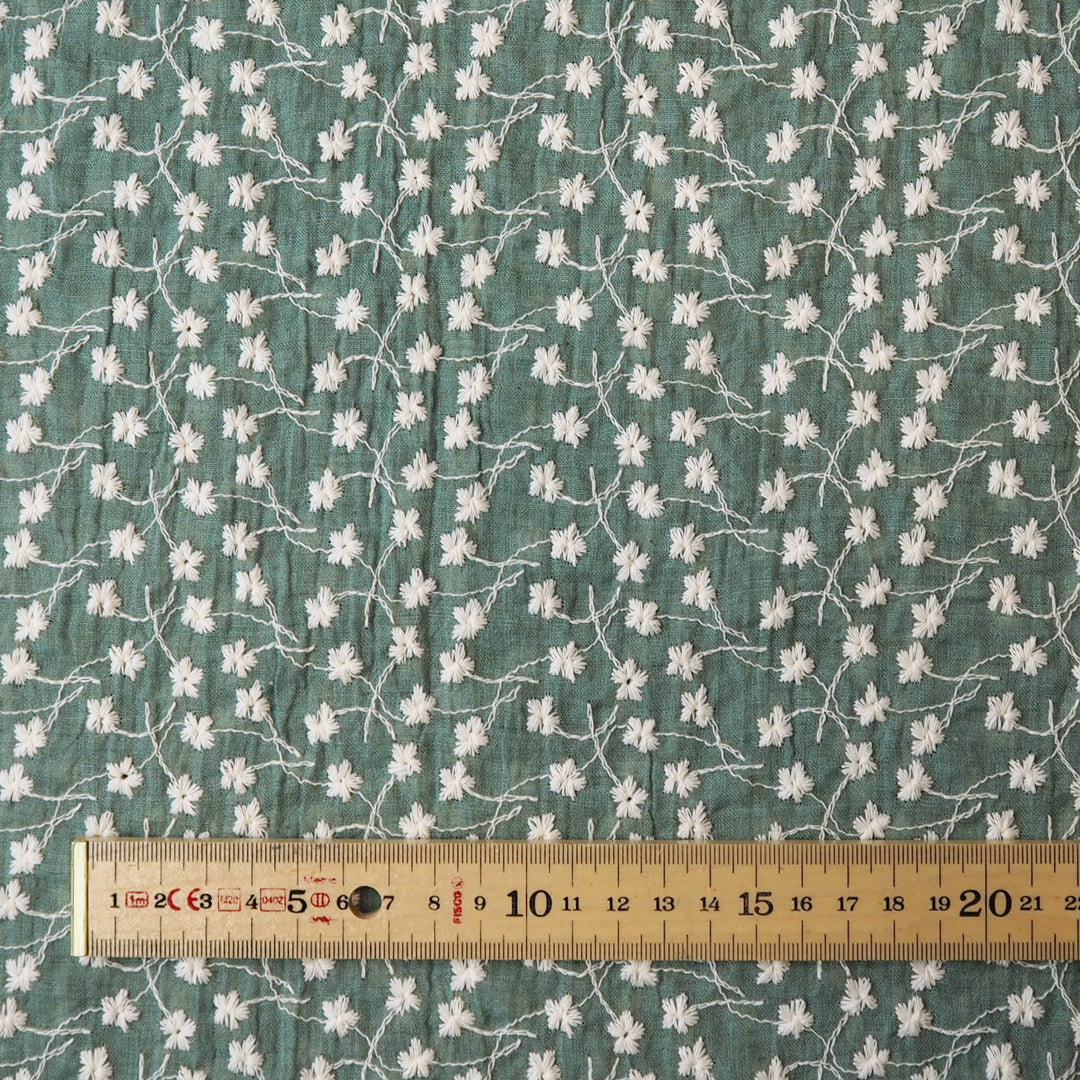 Bay leaf green embroidered cotton voile dressmaking fabric