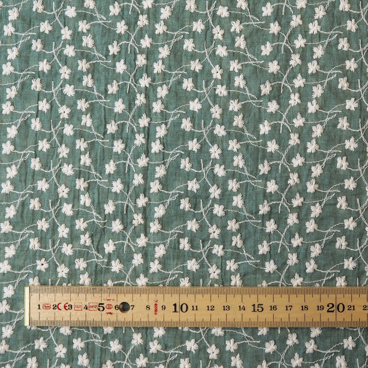 Bay leaf green embroidered cotton voile dressmaking fabric