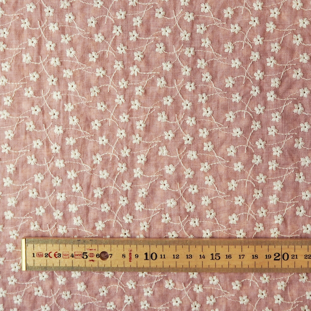Rose pink embroidered cotton voile dressmaking fabric