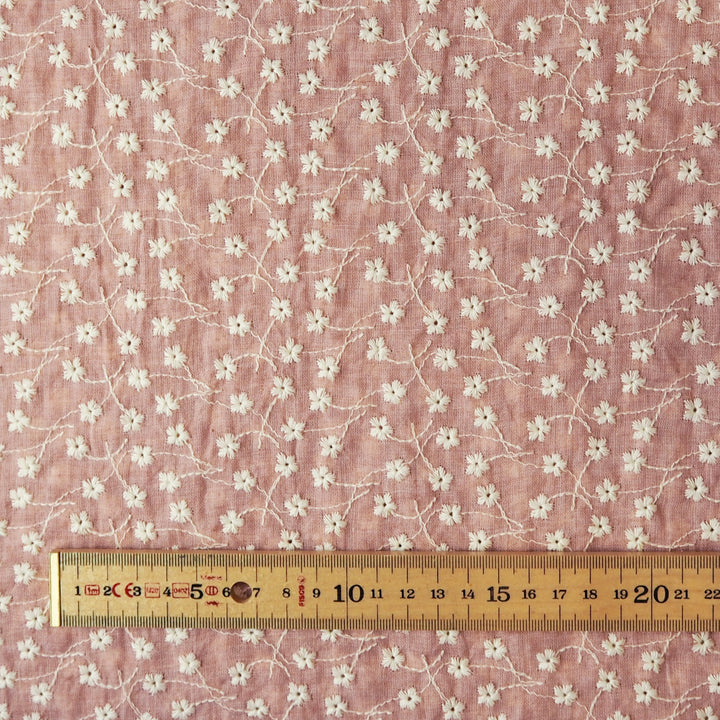 Rose pink embroidered cotton voile dressmaking fabric