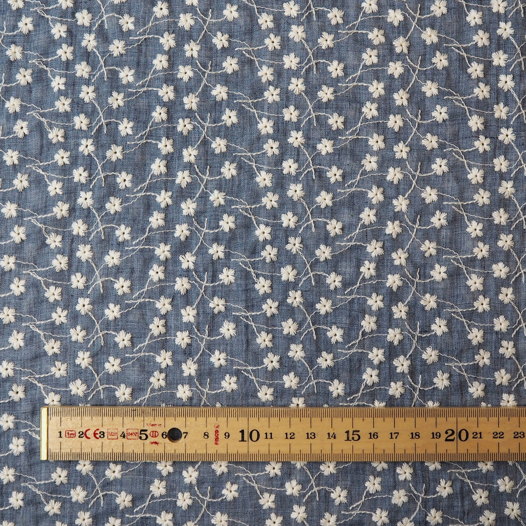 Denim blue embroidered cotton voile dressmaking fabric