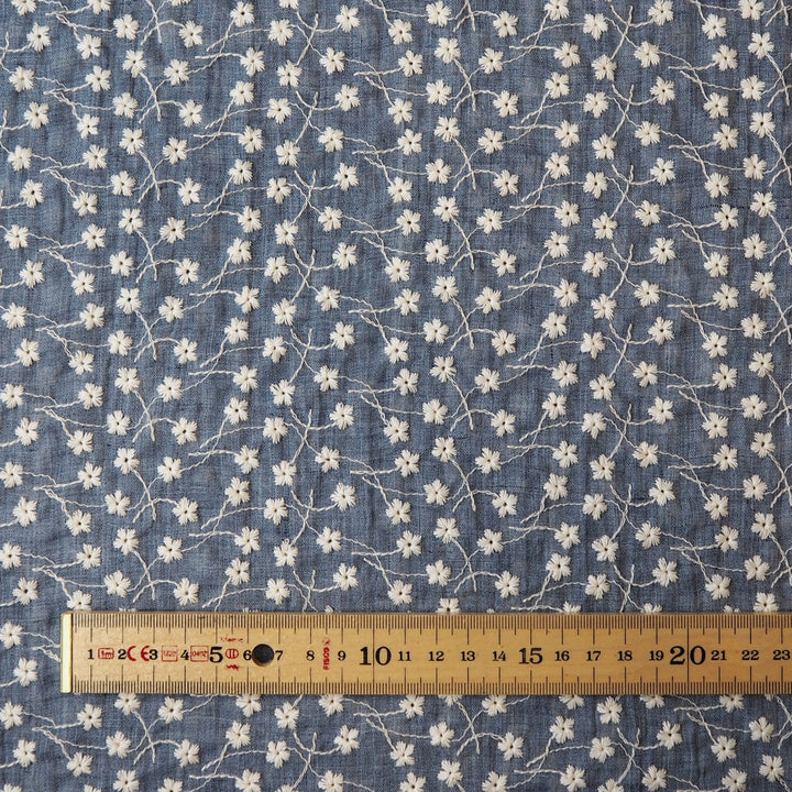 Denim blue embroidered cotton voile dressmaking fabric