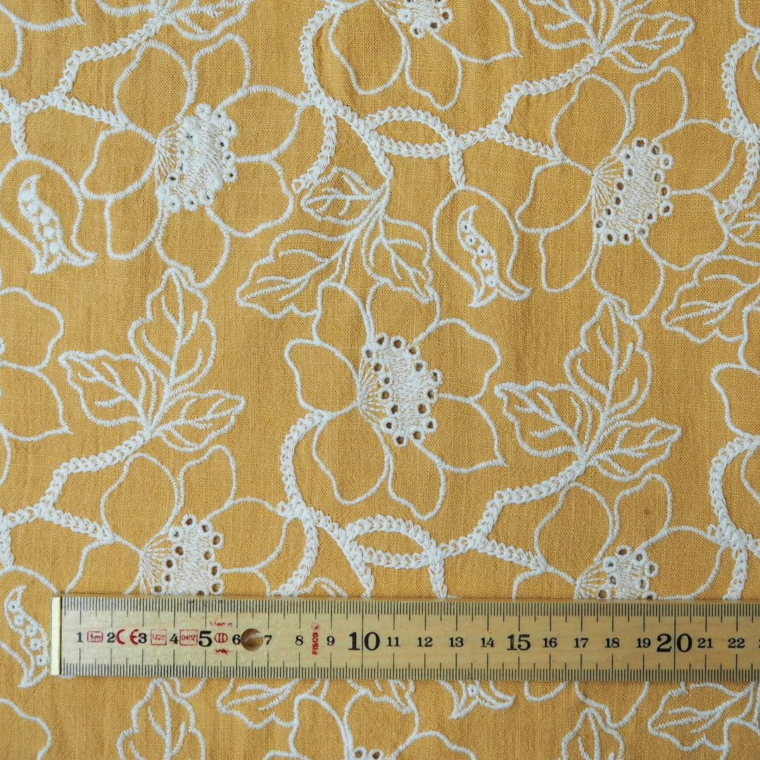 Mustard yellow floral embroidered viscose linen dressmaking fabric