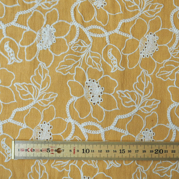 Mustard yellow floral embroidered viscose linen dressmaking fabric