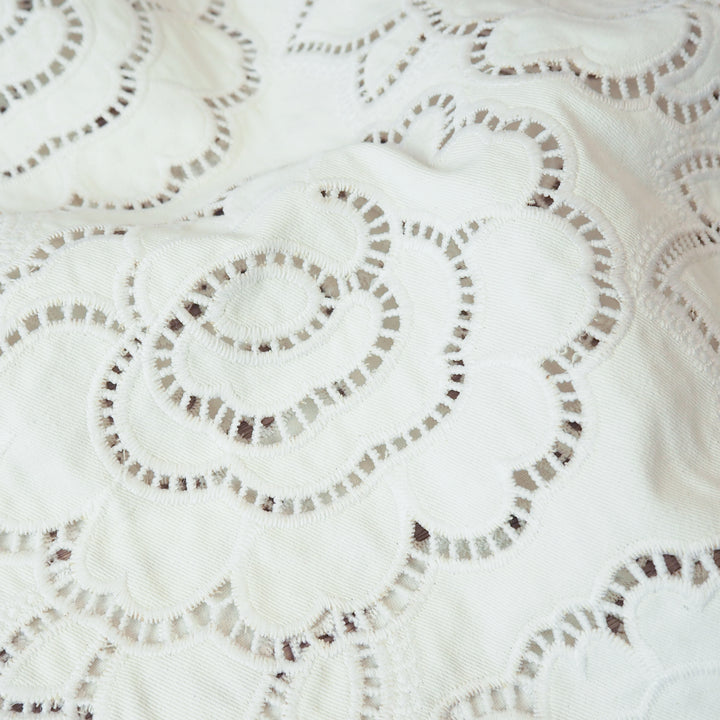Ivory cut-out floral denim fabric for dressmaking