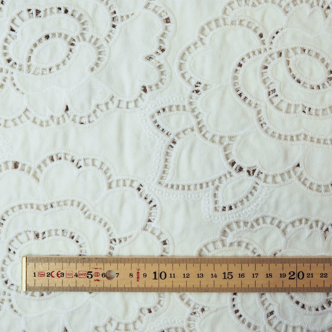Ivory cut-out floral denim fabric for dressmaking