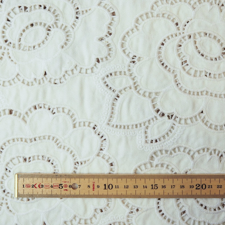 Ivory cut-out floral denim fabric for dressmaking
