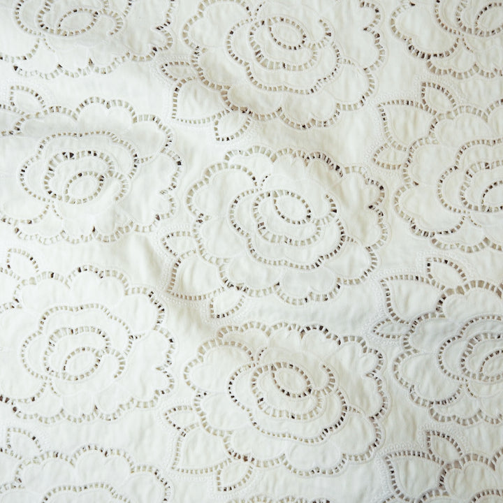 Ivory cut-out floral denim fabric for dressmaking