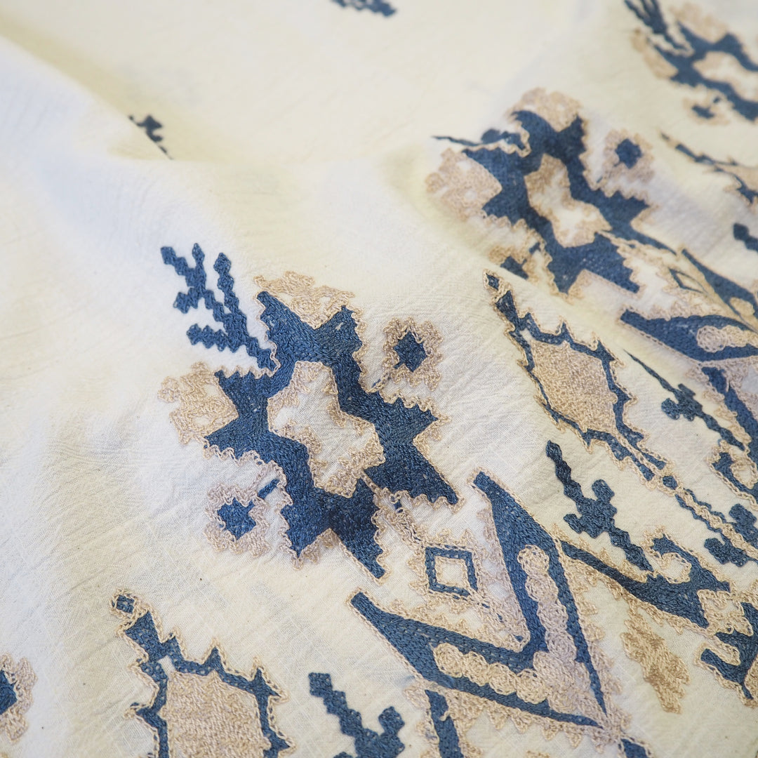 Geo border embroidered cotton blend dressmaking fabric