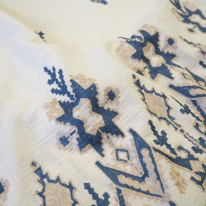 Geo border embroidered cotton blend dressmaking fabric