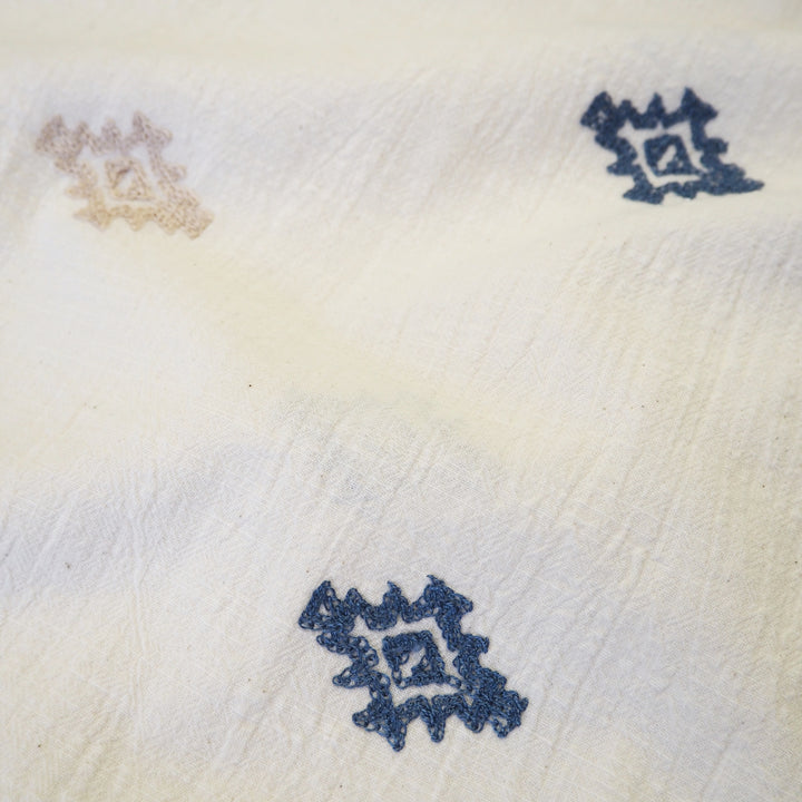 Geo border embroidered cotton blend dressmaking fabric