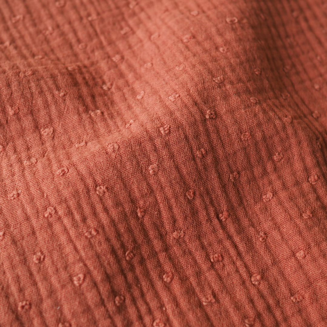 Rust dobby spot cotton double gauze dressmaking fabric