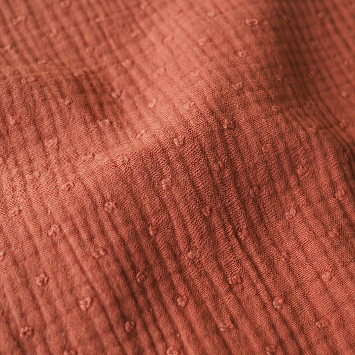 Rust dobby spot cotton double gauze dressmaking fabric