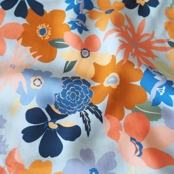 Colorful floral pattern on a light blue background