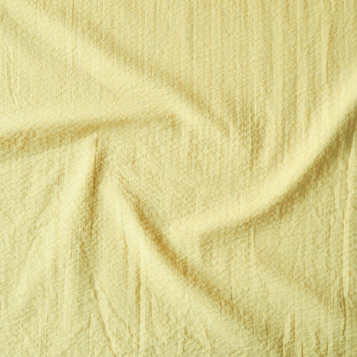 Close-up of yellow textured fabric