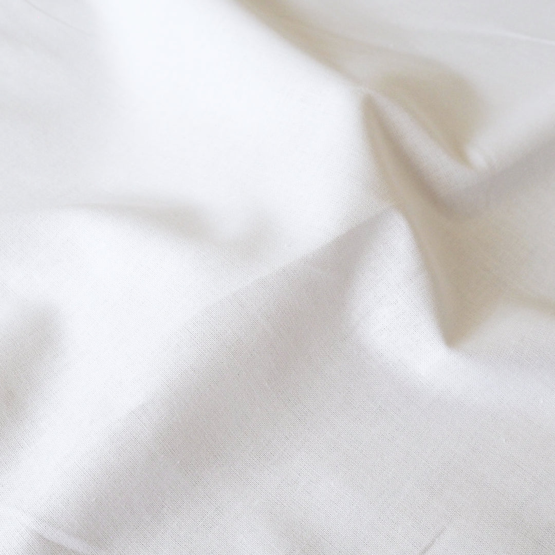 Close-up of white fabric with folds