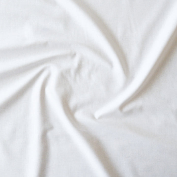 Close-up of white fabric with folds