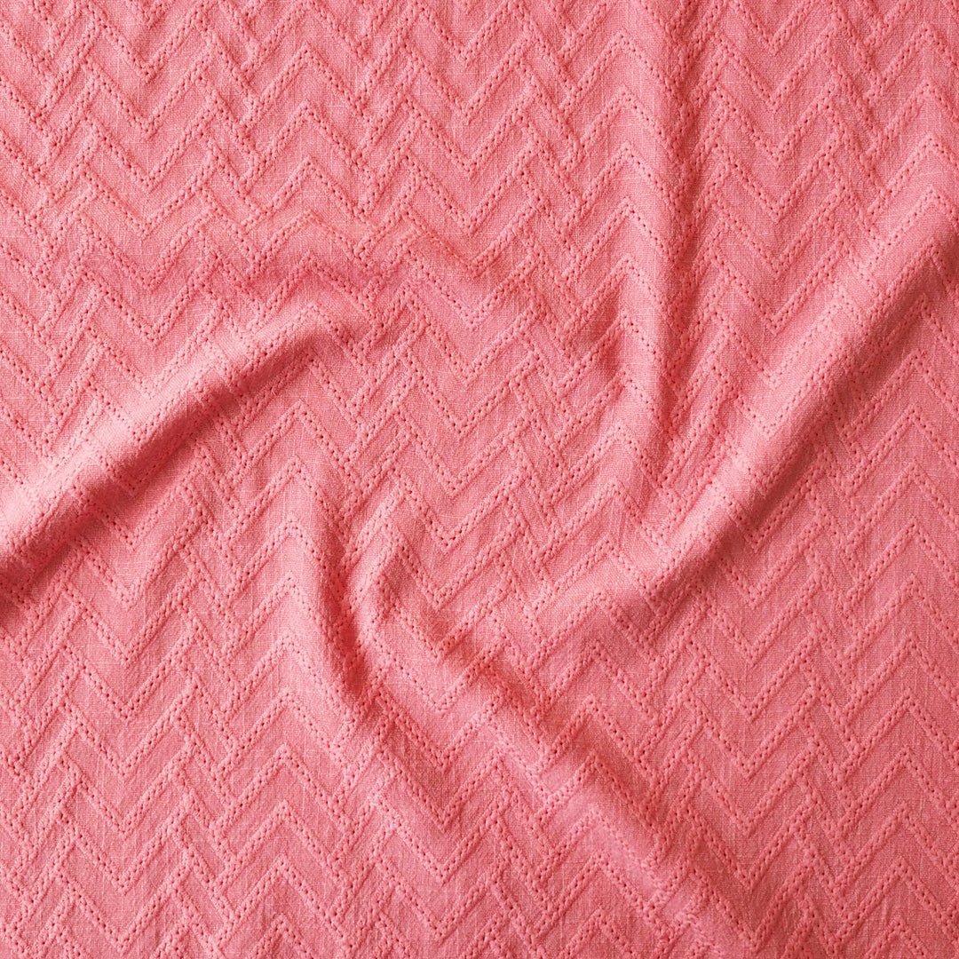 Pink fabric with a zigzag pattern
