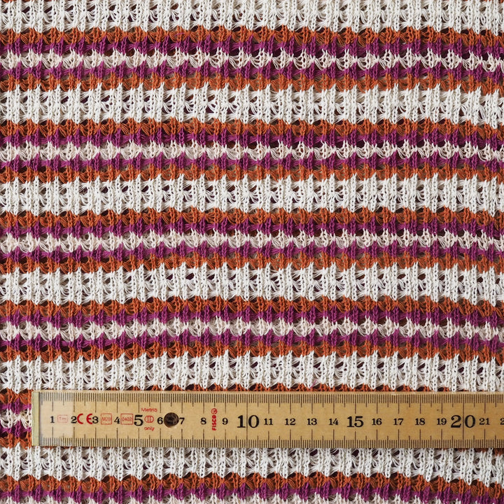 Striped knitted fabric with a ruler for scale
