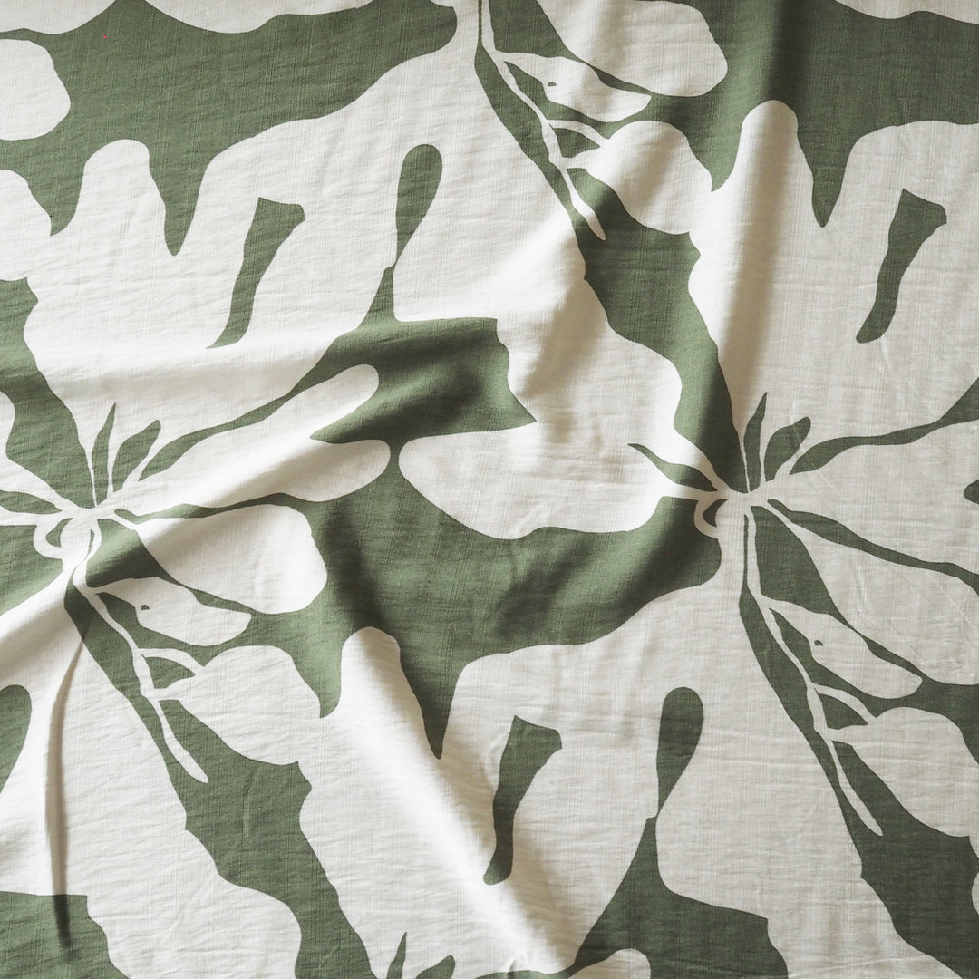 Fabric with green and white floral pattern