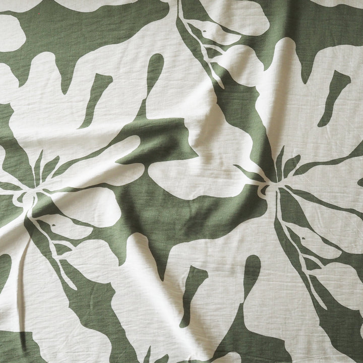 Fabric with green and white floral pattern