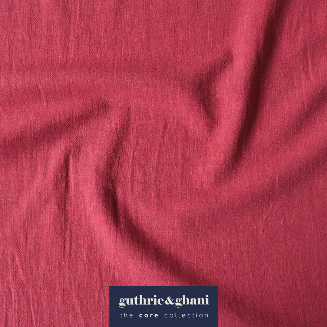 Pink fabric with 'guthrie & ghani' label in the corner