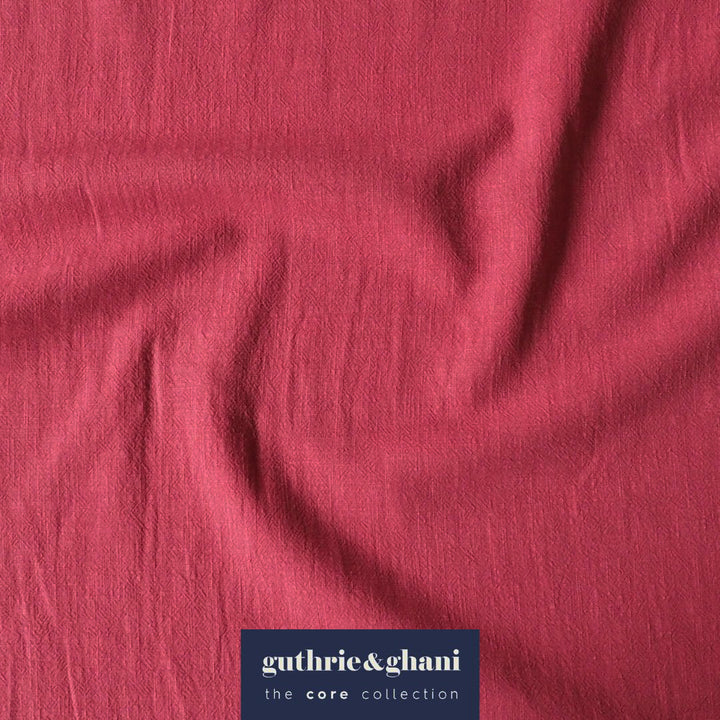 Pink fabric with 'guthrie & ghani' label in the corner