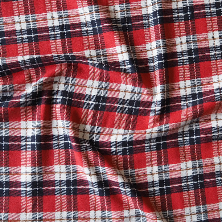 Red, navy, and white plaid fabric with a soft draped texture.