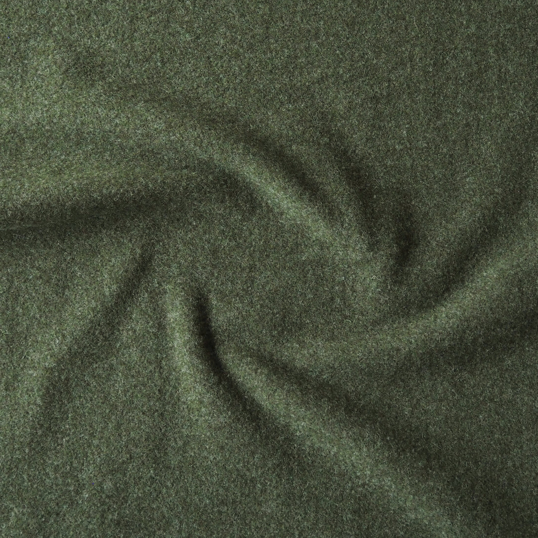 A close-up of dark olive green textured fabric, swirled in the center to show its soft, heathered surface.