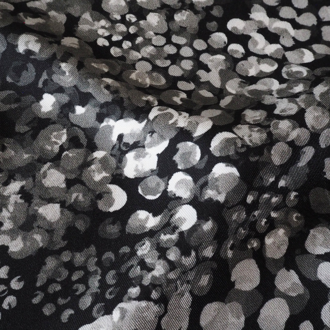 Monochrome Chicacheetah viscose twill sateen fabric featuring a black and white animal-inspired print, exclusive to Guthrie & Ghani.