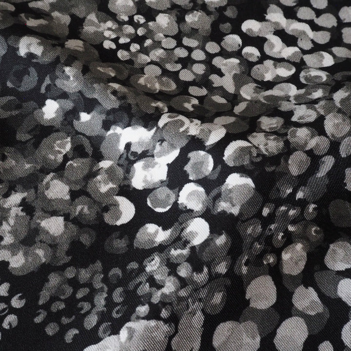 Monochrome Chicacheetah viscose twill sateen fabric featuring a black and white animal-inspired print, exclusive to Guthrie & Ghani.