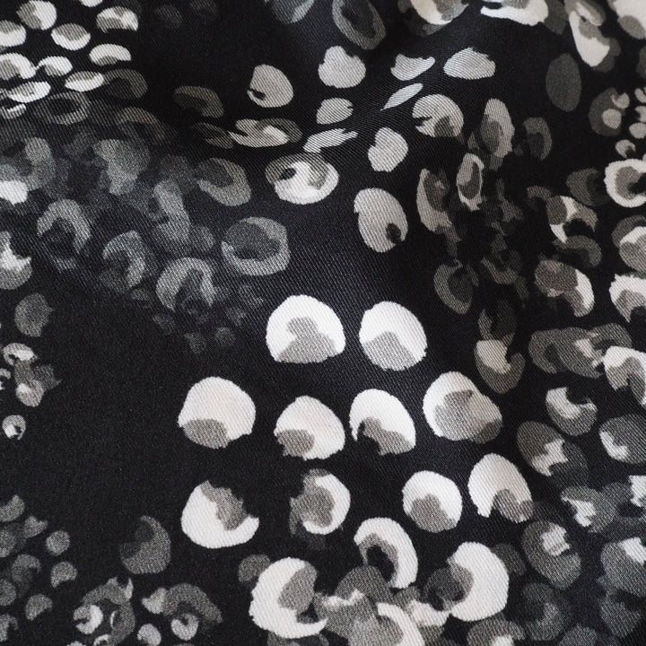 Monochrome Chicacheetah viscose twill sateen fabric featuring a black and white animal-inspired print, exclusive to Guthrie & Ghani.