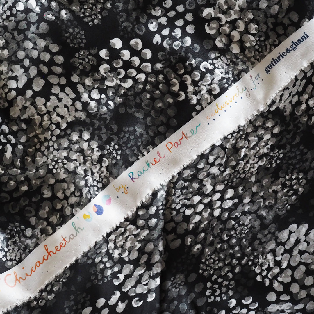 Monochrome Chicacheetah viscose twill sateen fabric featuring a black and white animal-inspired print, exclusive to Guthrie & Ghani.
