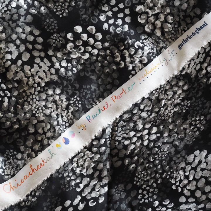 Monochrome Chicacheetah viscose twill sateen fabric featuring a black and white animal-inspired print, exclusive to Guthrie & Ghani.